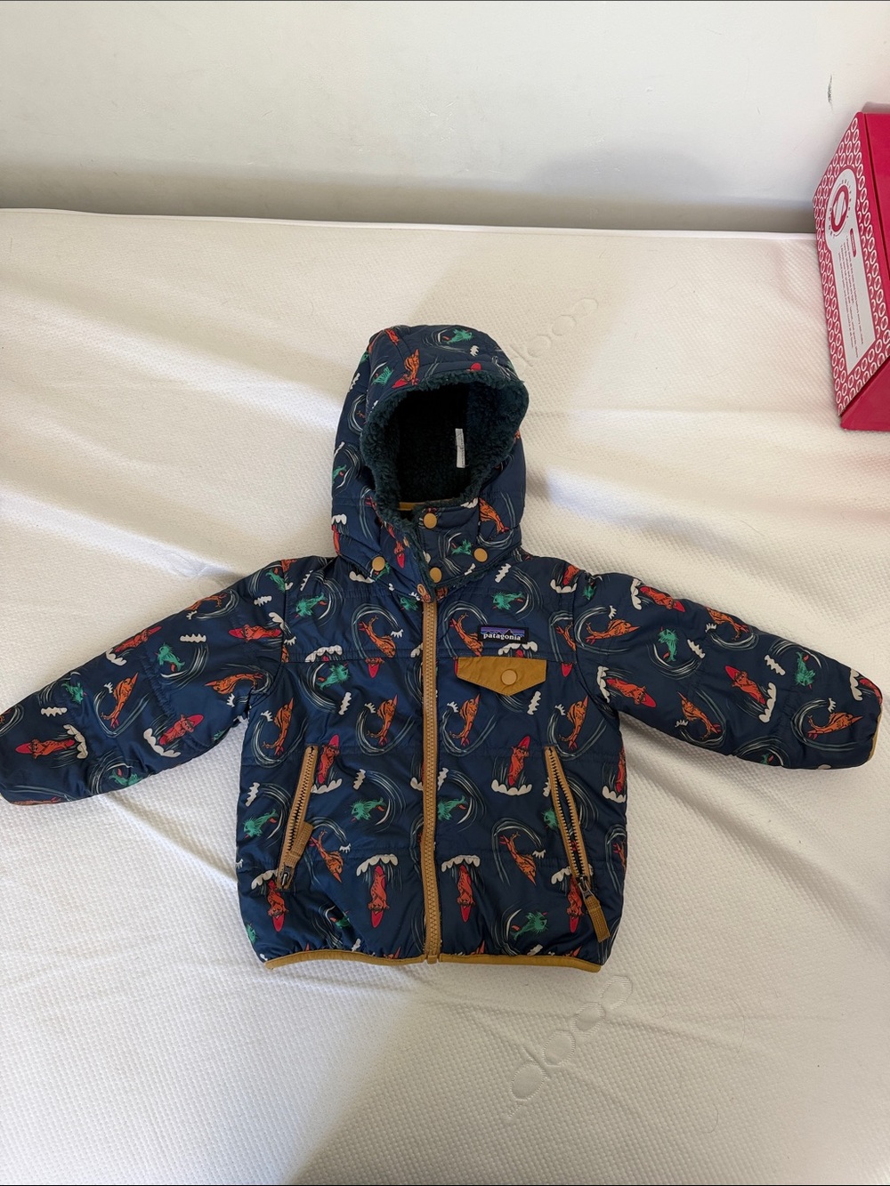 Patagonia Kids Navy Hooded Puffer Jacket with Multicolored Fish Print